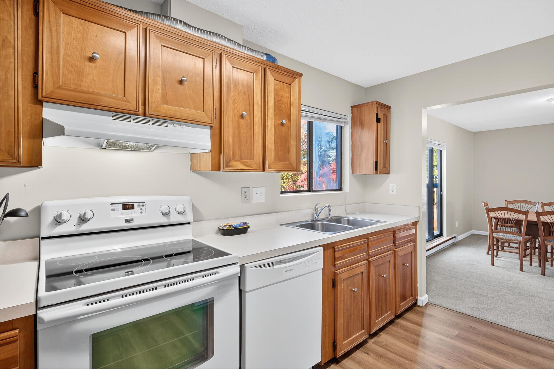 a kitchen with a sink stove and cabinets