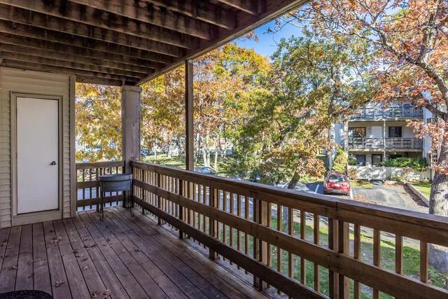 a view of a porch with wooden floor