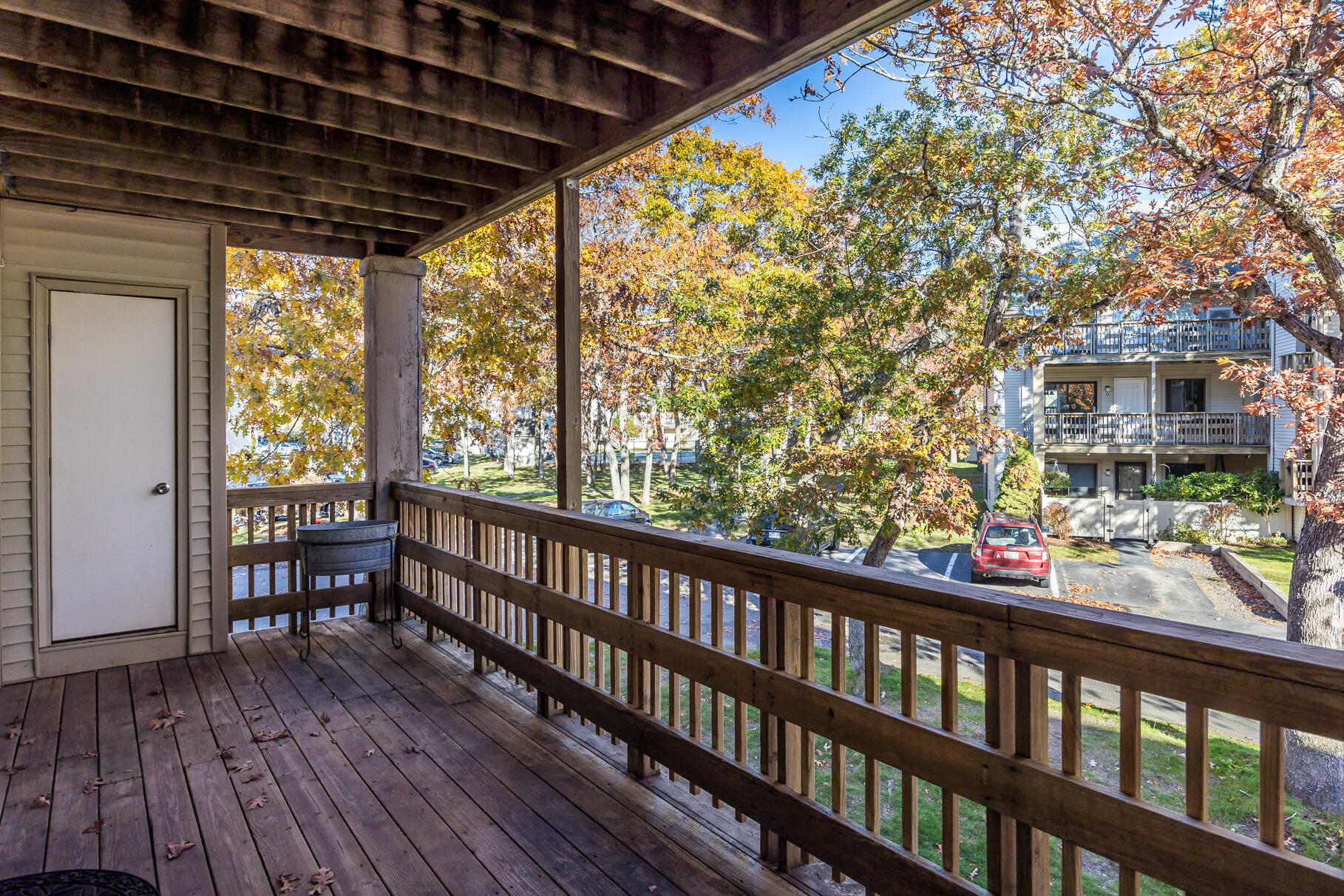 800 Bearses Way, Unit 1NE Hyannis, MA 02601 - Photo 23 of 27 a view of a porch with wooden floor