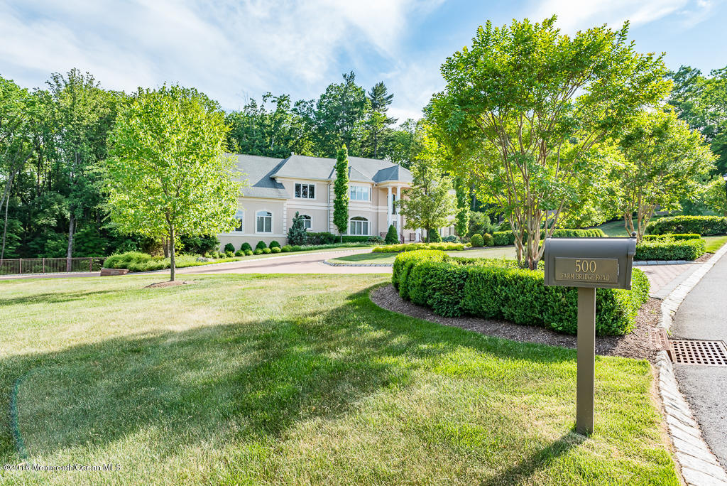 500 Farm Bridge Road Marlboro, NJ 07746 - Photo 2 of 57 a view of a house with a backyard and a tree