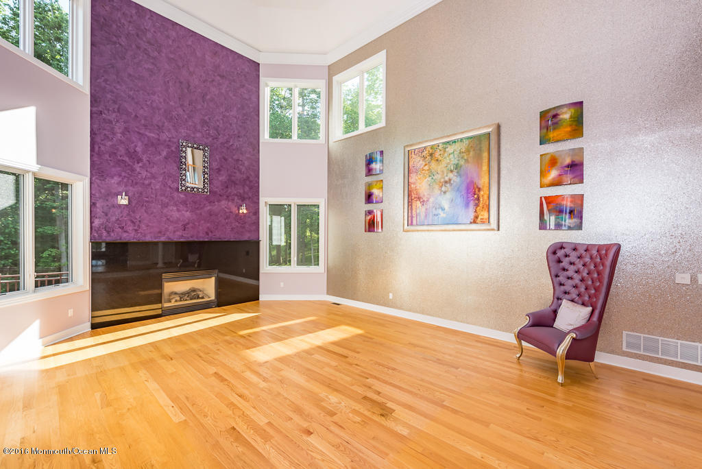 500 Farm Bridge Road Marlboro, NJ 07746 - Photo 12 of 57 a spacious bedroom with a bed and a fireplace