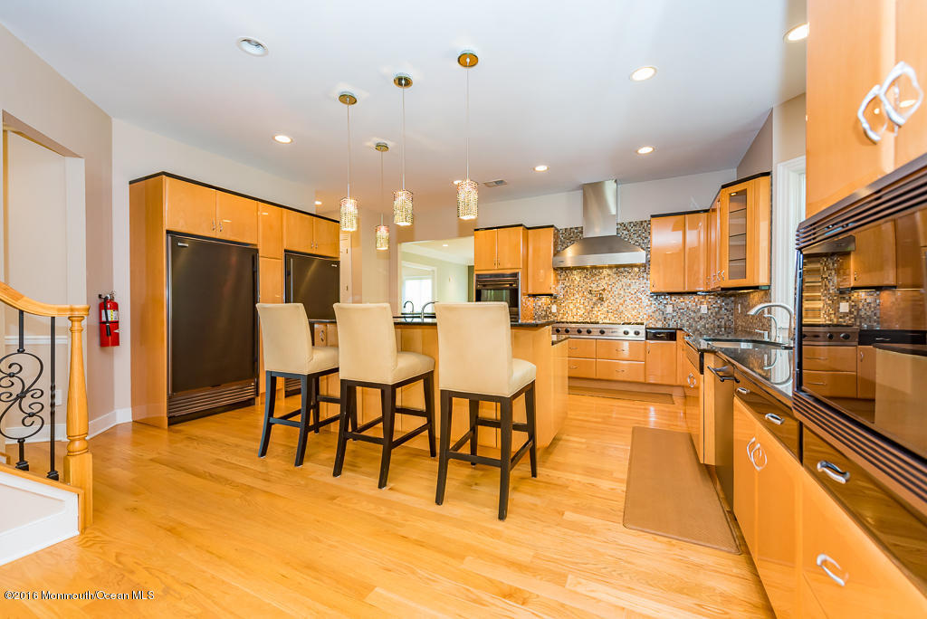 500 Farm Bridge Road Marlboro, NJ 07746 - Photo 15 of 57 a view of a kitchen with kitchen island granite countertop lots of counter top space and stainless steel appliances