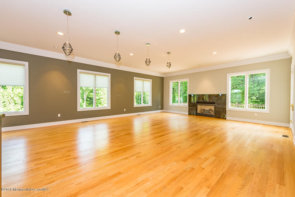 500 Farm Bridge Road Marlboro, NJ 07746 - Photo 21 of 57 a view of empty room with wooden floor and fan