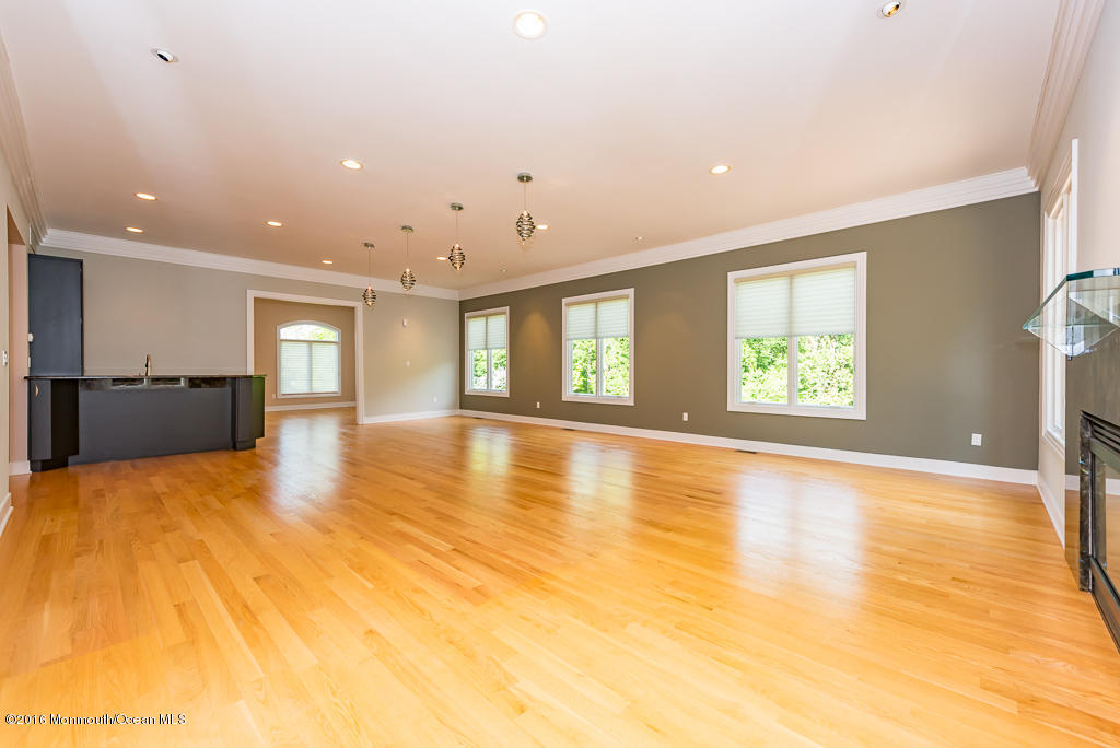 500 Farm Bridge Road Marlboro, NJ 07746 - Photo 22 of 57 a view of an empty room with kitchen and window