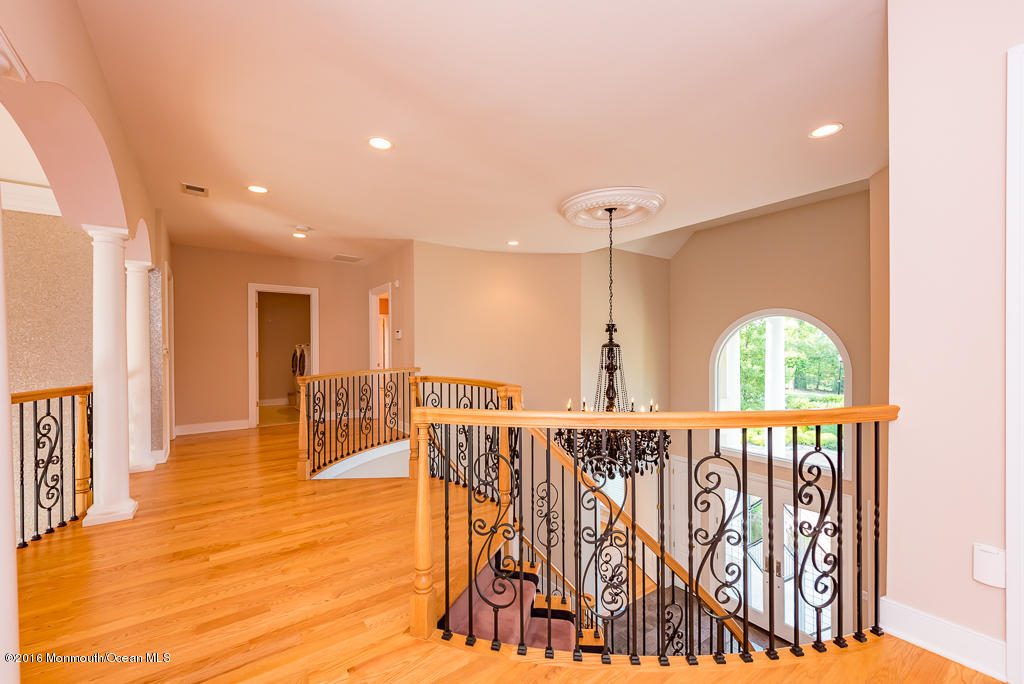500 Farm Bridge Road Marlboro, NJ 07746 - Photo 30 of 57 a view of a hallway with wooden floor