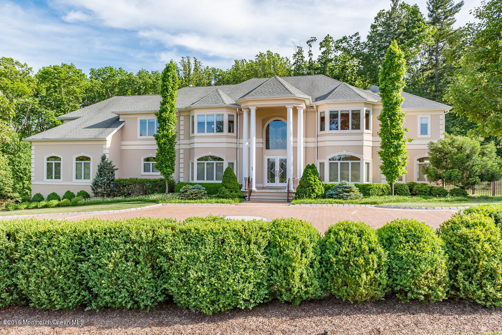 500 Farm Bridge Road Marlboro, NJ 07746 - Photo 4 of 57 a front view of a house with a yard