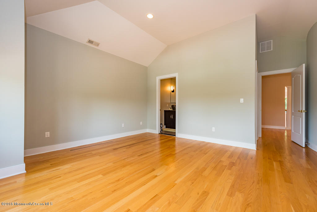 500 Farm Bridge Road Marlboro, NJ 07746 - Photo 40 of 57 a view of an empty room with wooden floor
