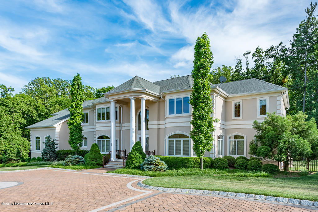 500 Farm Bridge Road Marlboro, NJ 07746 - Photo 5 of 57 a front view of a house with a yard