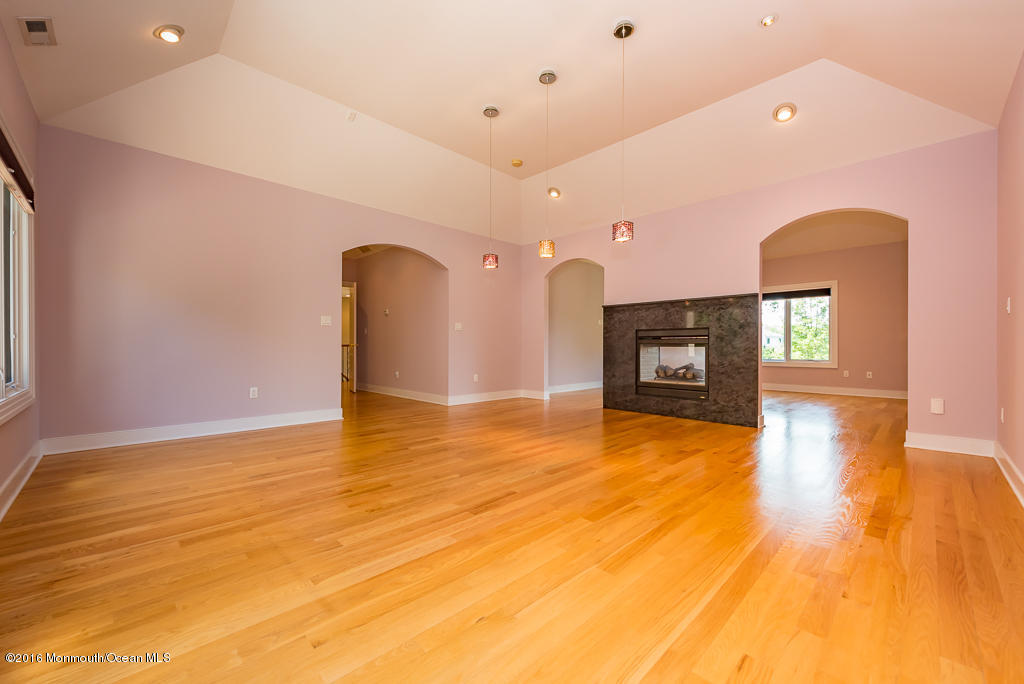 500 Farm Bridge Road Marlboro, NJ 07746 - Photo 42 of 57 a view of a livingroom with a fireplace