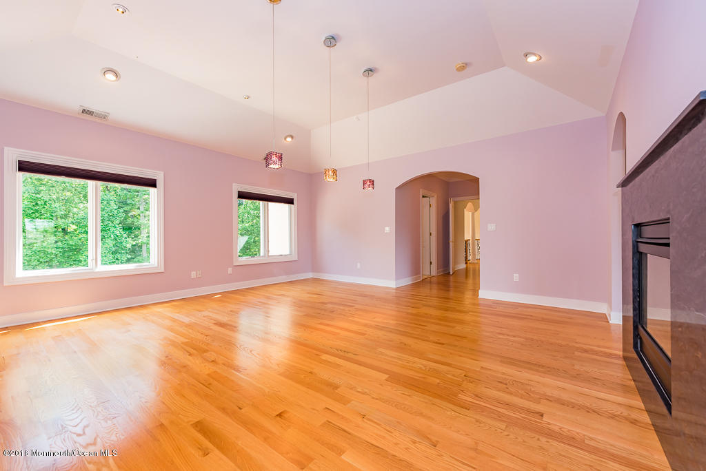 500 Farm Bridge Road Marlboro, NJ 07746 - Photo 43 of 57 a view of empty room with wooden floor and fan