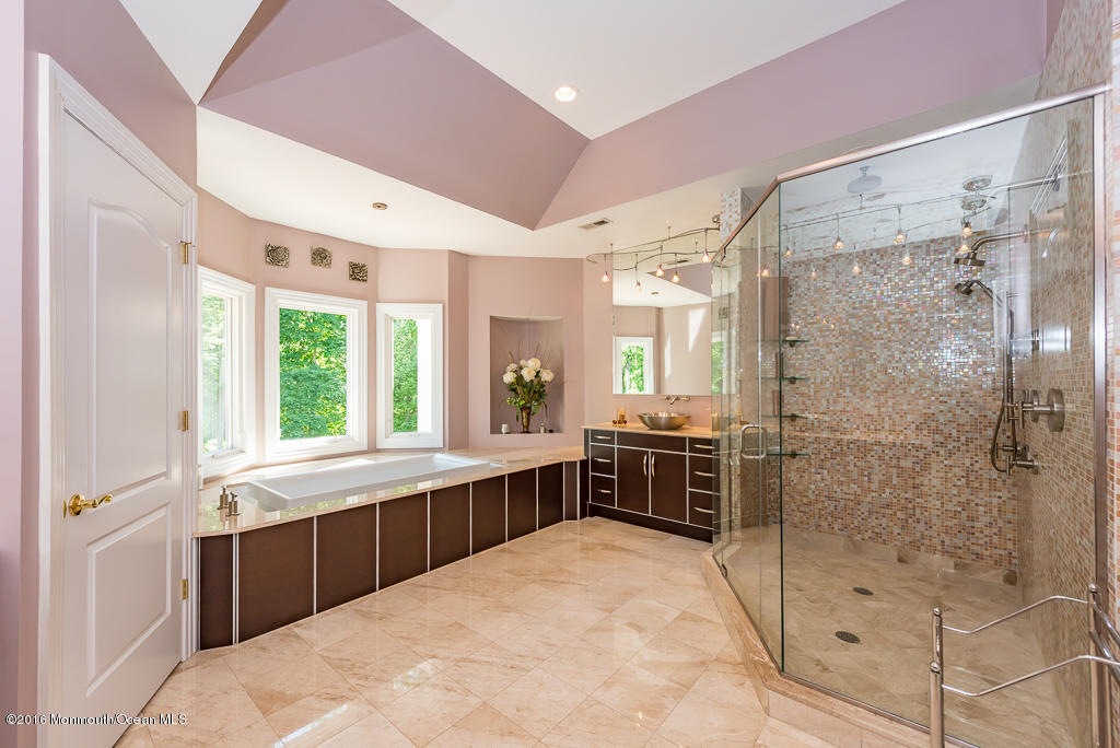 500 Farm Bridge Road Marlboro, NJ 07746 - Photo 46 of 57 a large bathroom with a tub sink shower and mirror
