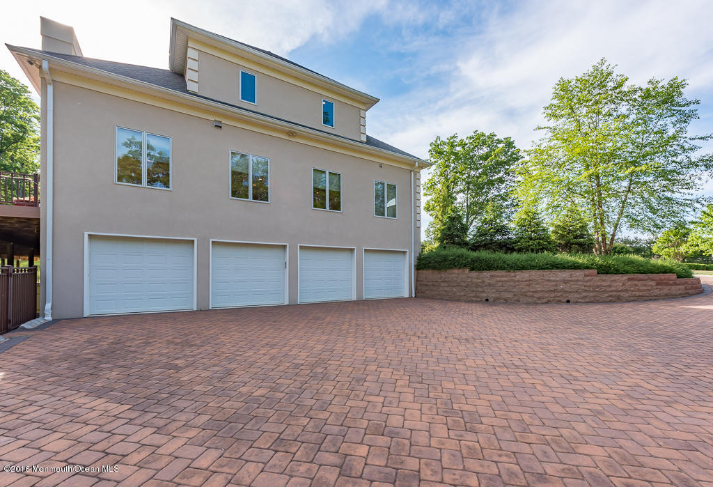 500 Farm Bridge Road Marlboro, NJ 07746 - Photo 6 of 57 a front view of house with yard and trees