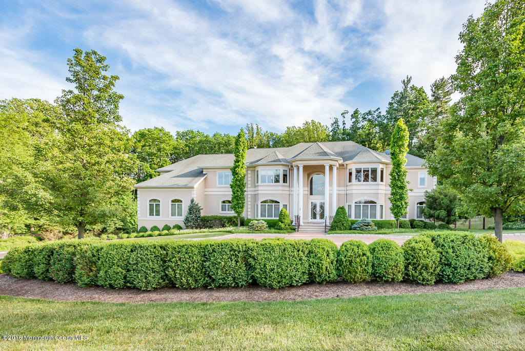 500 Farm Bridge Road Marlboro, NJ 07746 - Photo 57 of 57 a front view of a house with a yard