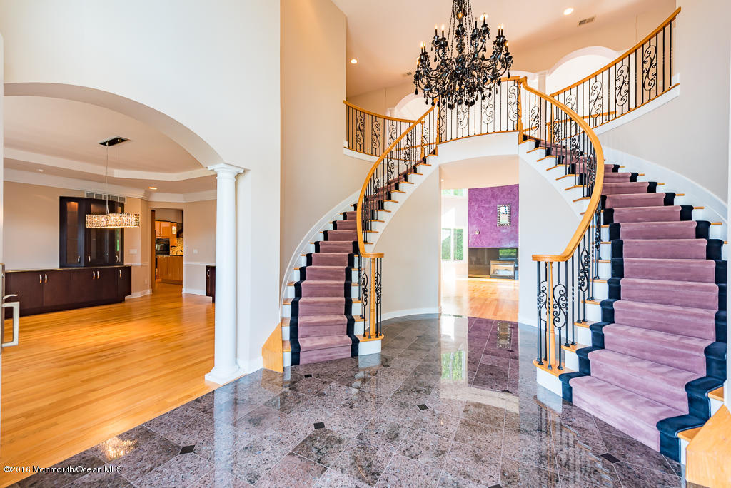 500 Farm Bridge Road Marlboro, NJ 07746 - Photo 8 of 57 a view of entryway and hall with wooden floor