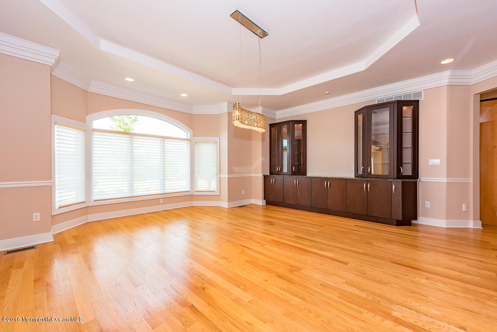 500 Farm Bridge Road Marlboro, NJ 07746 - Photo 10 of 57 a view of an empty room with window and wooden floor