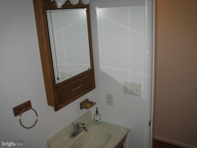 1213 Krueger Avenue Rosedale, MD 21237 - Photo 11 of 27 a bathroom with a sink and a mirror