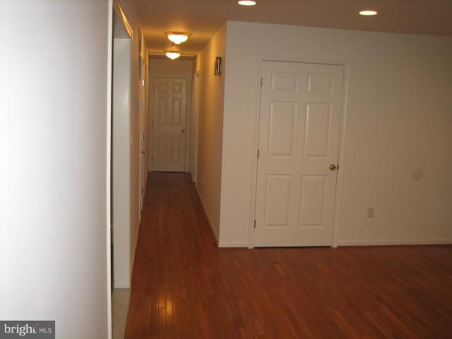 1213 Krueger Avenue Rosedale, MD 21237 - Photo 22 of 27 a view of a hallway with wooden floor