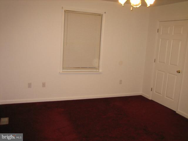 1213 Krueger Avenue Rosedale, MD 21237 - Photo 24 of 27 an empty room with a wooden door