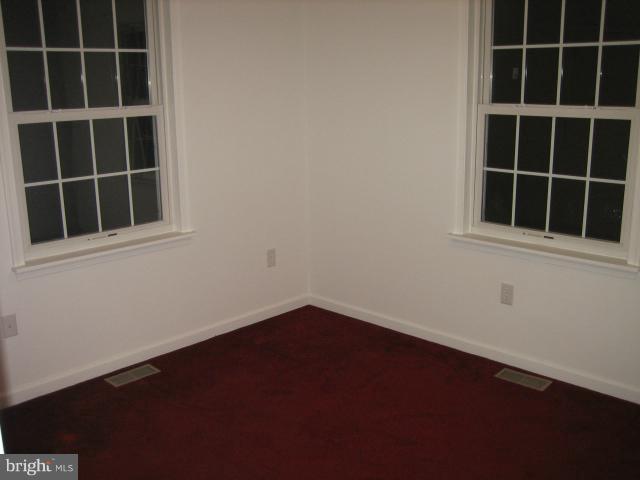 1213 Krueger Avenue Rosedale, MD 21237 - Photo 25 of 27 a view of an empty room with a window and a cabinet