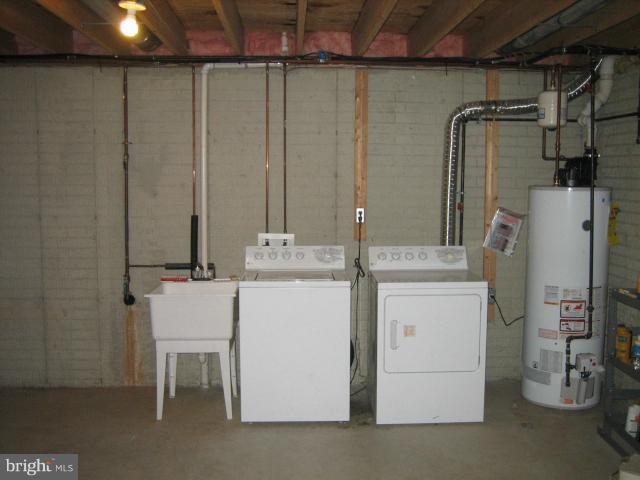 1213 Krueger Avenue Rosedale, MD 21237 - Photo 26 of 27 a bathroom with a sink and a washing machine