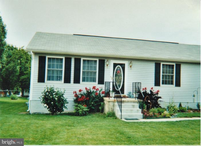 1213 Krueger Avenue Rosedale, MD 21237 - Photo 27 of 27 a front view of a house with a garden and plants