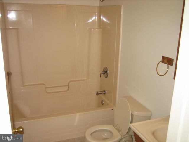1213 Krueger Avenue Rosedale, MD 21237 - Photo 5 of 27 a bathroom with a toilet and a shower
