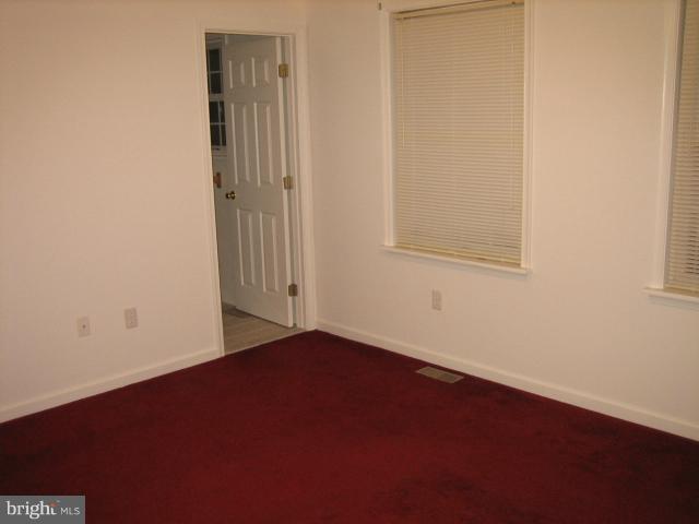1213 Krueger Avenue Rosedale, MD 21237 - Photo 7 of 27 an empty room with a window
