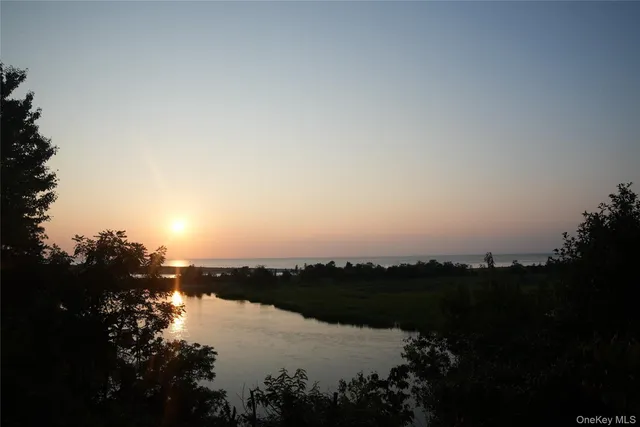 a view of lake and sunset