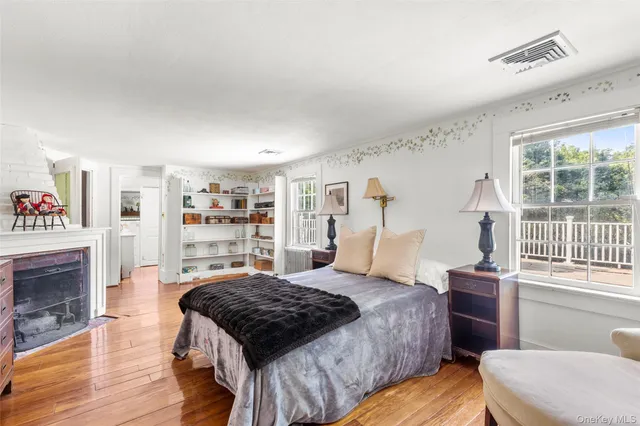 a bedroom with a bed and a fireplace