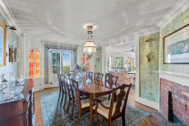 a view of a dining room with furniture and window