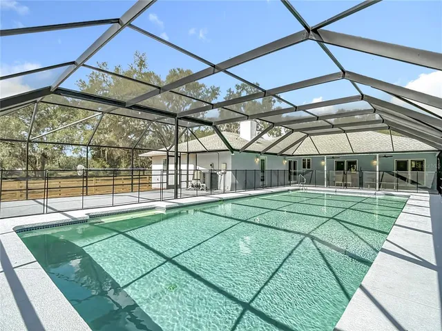 a view of a patio with a table and chairs