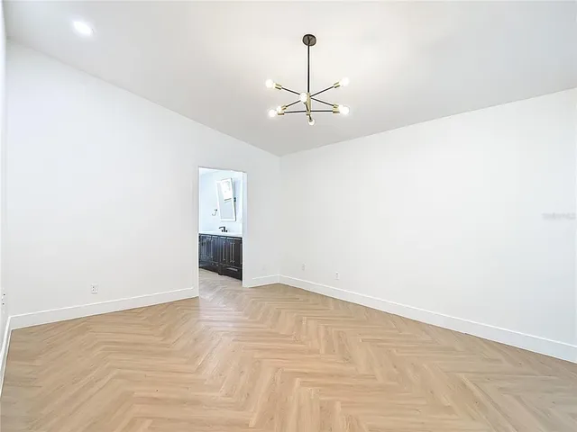 a kitchen with stainless steel appliances a refrigerator and cabinets