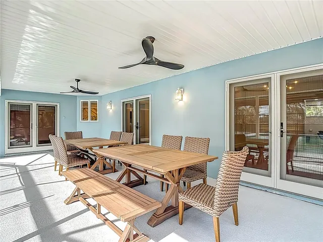 a view of a swimming pool with an outdoor space and seating area