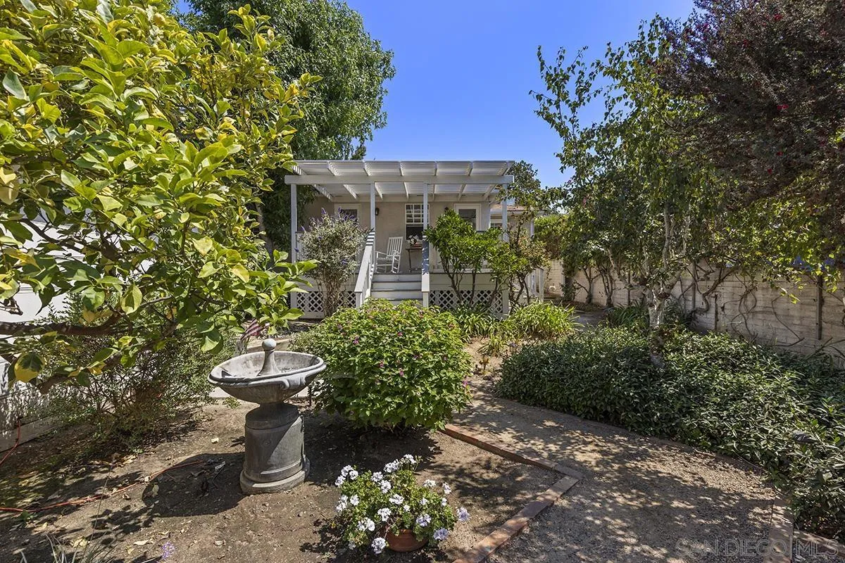 5532 Bellevue Avenue La Jolla, CA 92037 - Photo 21 of 26 a view of a backyard with plants and a fountain