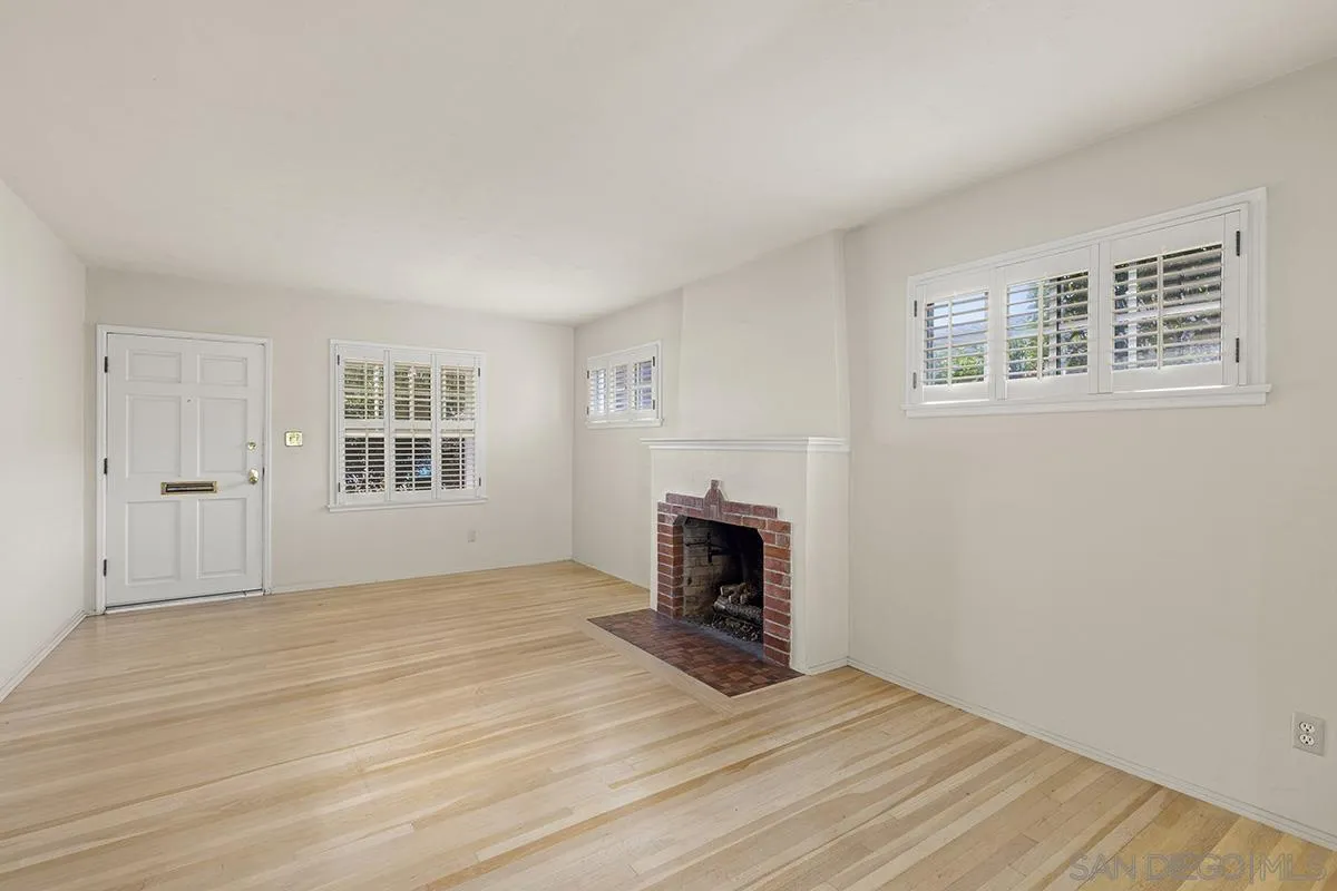 5532 Bellevue Avenue La Jolla, CA 92037 - Photo 3 of 26 a view of empty room with a fireplace and window