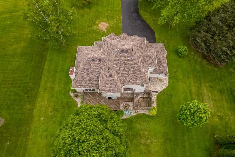 8833 West Ridge Drive Belvidere, IL 61008 - Photo 16 of 65 an aerial view of a house with a yard