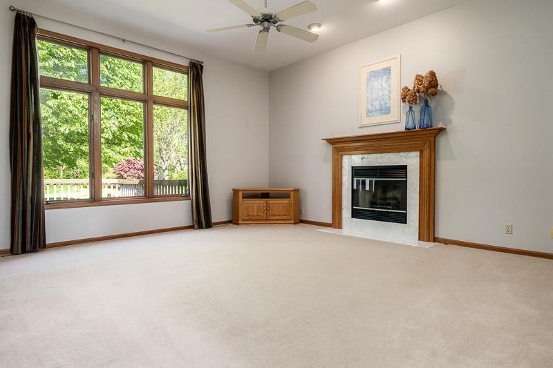 8833 West Ridge Drive Belvidere, IL 61008 - Photo 22 of 65 an empty room with windows and fireplace
