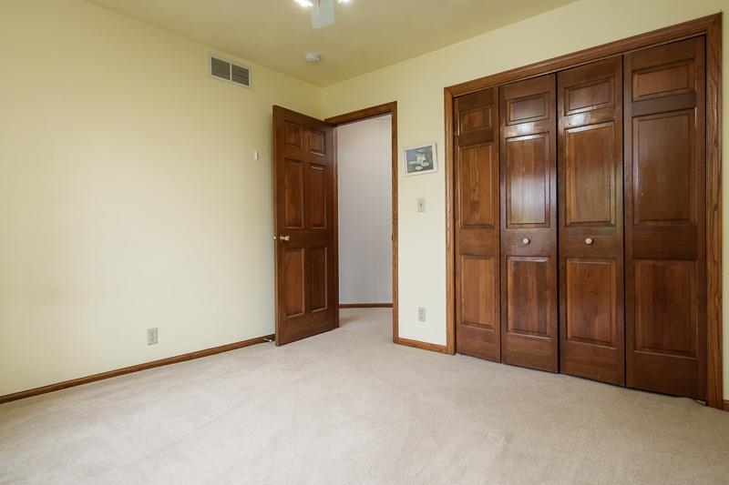 8833 West Ridge Drive Belvidere, IL 61008 - Photo 54 of 65 an empty room with closet and wooden floor