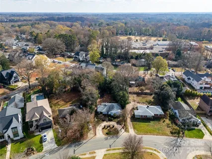 an aerial view of a house with a garden