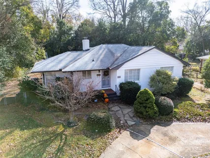 a backyard of a house with lots of green space