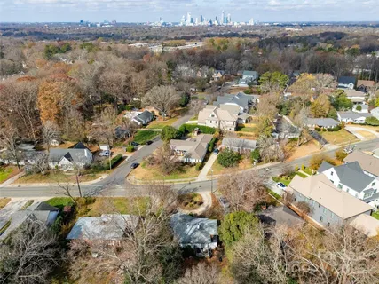 an aerial view of residential building with outdoor space and lake view