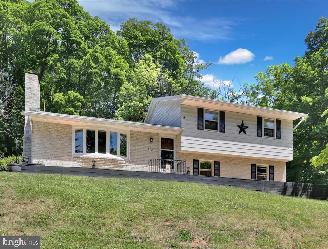 1907 Holly Road Reading, PA 19602 - Photo 1 of 22 Charming hillside home with lush backdrop.