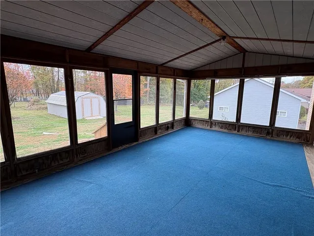a view of an empty room with a window