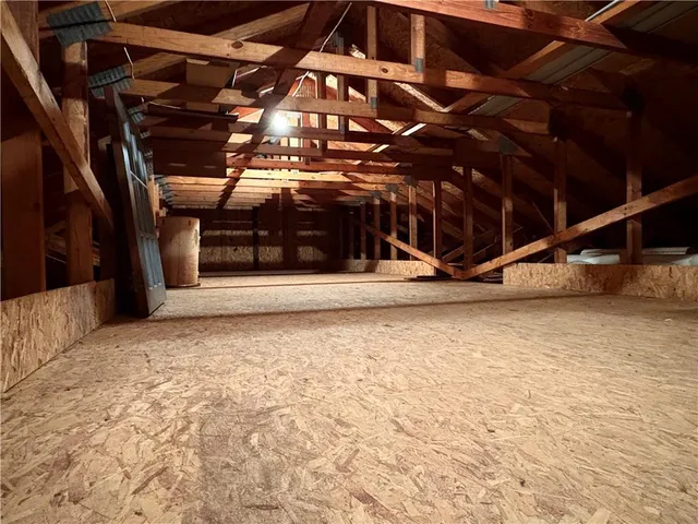 a view of a room with wooden walls