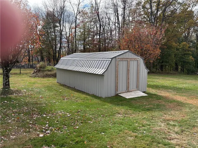 a view of a backyard with a trees
