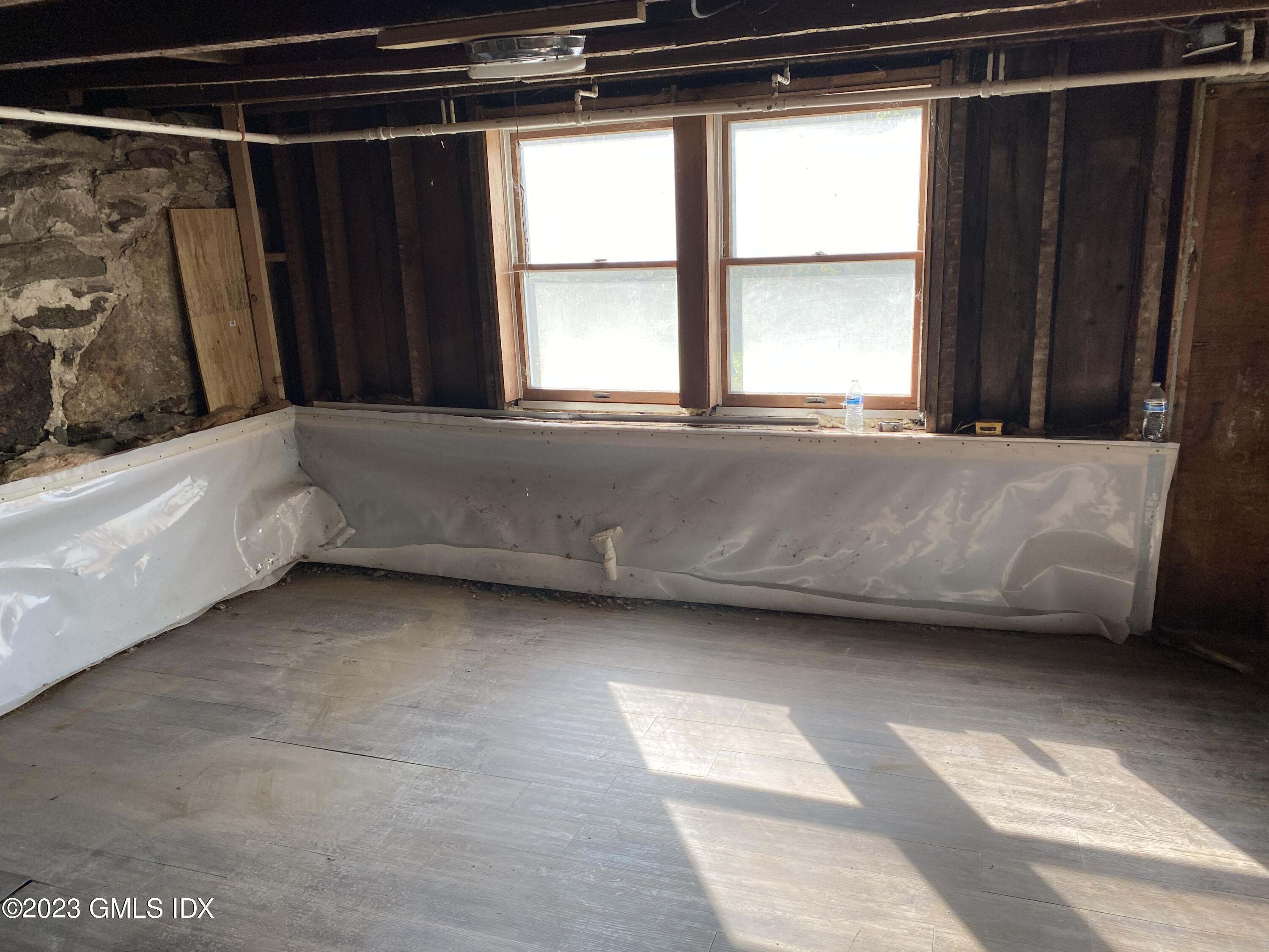 134 Byram Road Greenwich, CT 06830 - Photo 11 of 15 a bath tub sitting in a bathroom next to a window