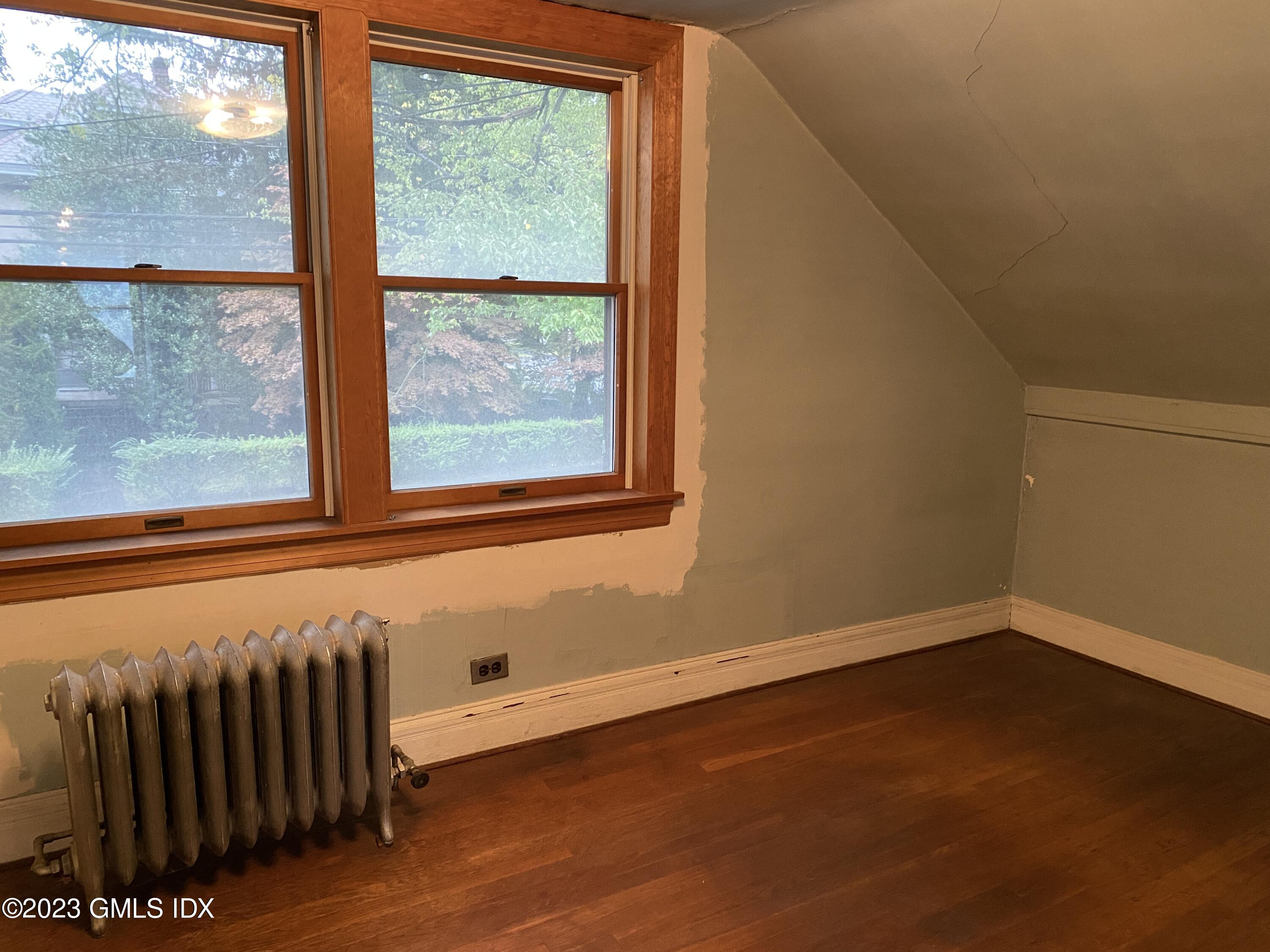 134 Byram Road Greenwich, CT 06830 - Photo 8 of 15 a view of a room with wooden floor and windows