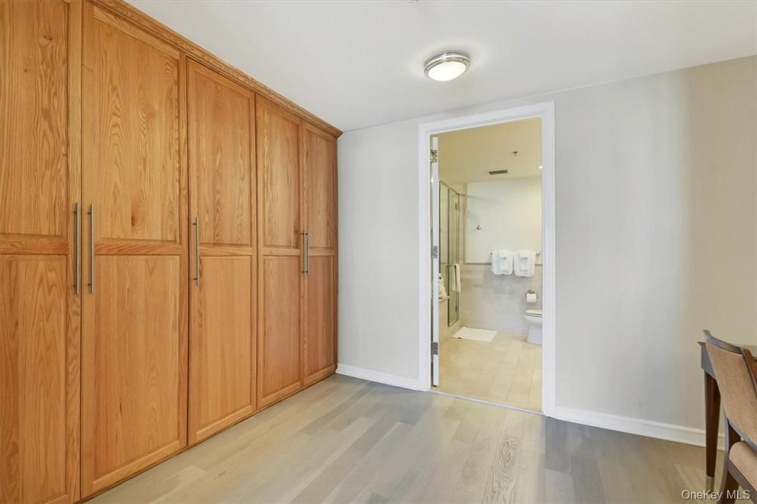 1 Renaissance Square, Unit 7B White Plains, NY 10601 - Photo 8 of 10 wooden floor with a bathroom