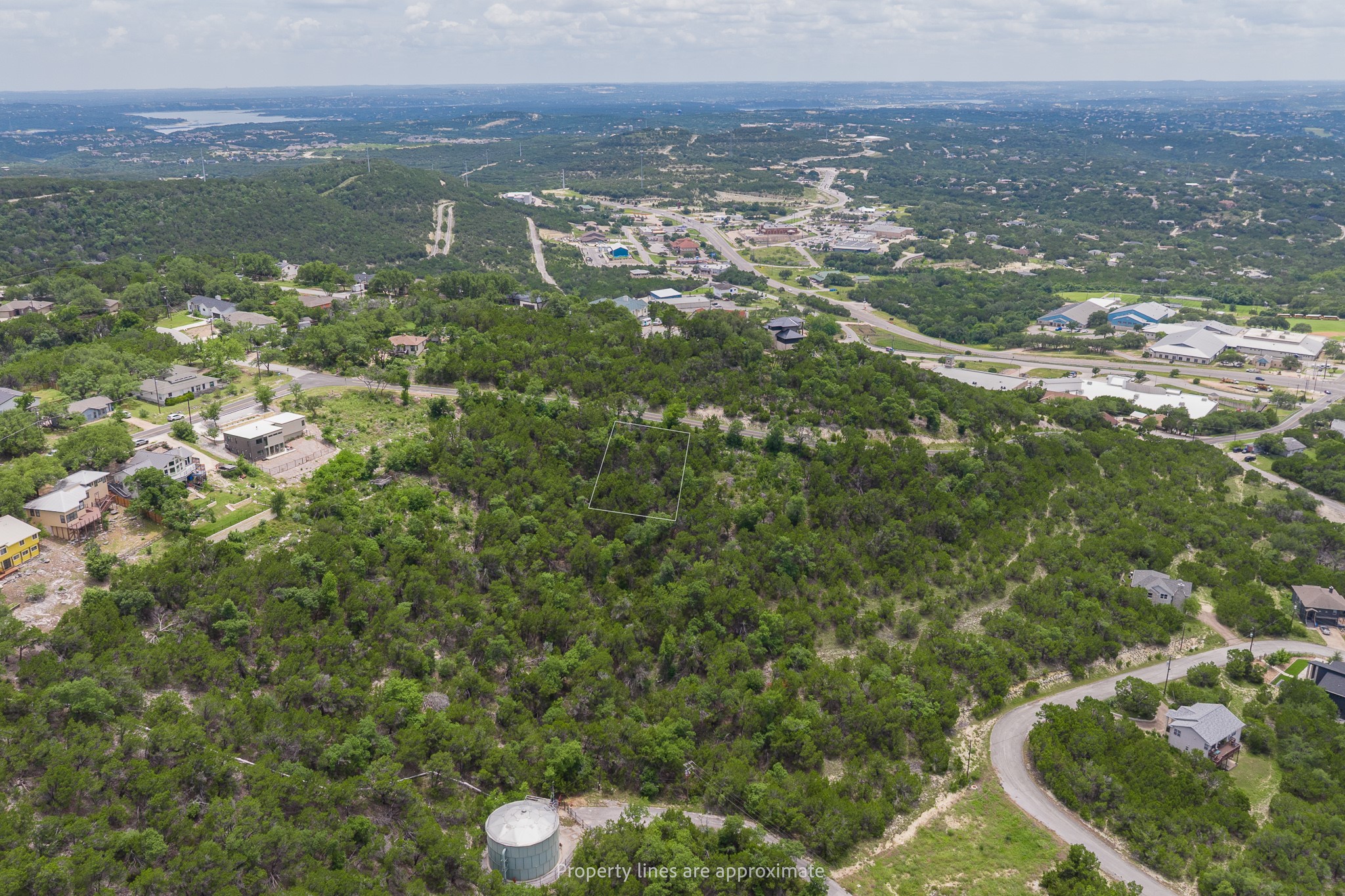 8220 Bar K Ranch Road Lago Vista, TX 78645 - Photo 3 of 8 Vast, verdant landscape offering a panoramic view of the surrounding terrain and distant community.