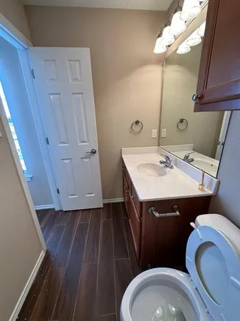a bathroom with a toilet and a bathtub